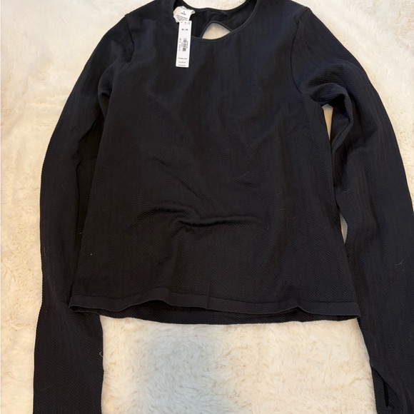 PINK Victoria's Secret Tops - PINK Victoria’s Secret black athletic top, has cutout. Size medium NWT